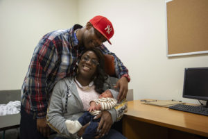 IVAN MOSLEY, LATARCHA MOSLEY (SEATED) WITH THEIR NEWBORN BABY JEREMIAH. EAGLE PHOTOS BY JONATHAN SPERLING.