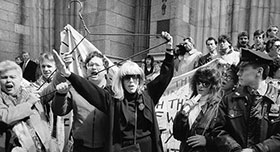 Merle Hoffman raises her trademark hanger outside St Patricks Cathedral in New York in 1989. This was historic first pro-choice civil disobedience action.